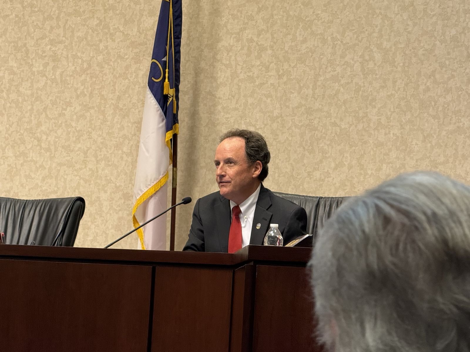 Chris Parker at a Utility Commission meeting