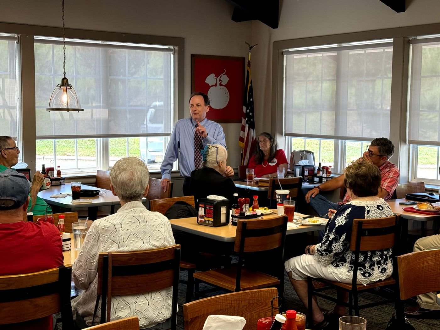 Chris Parker speaking to residents at a community lunch